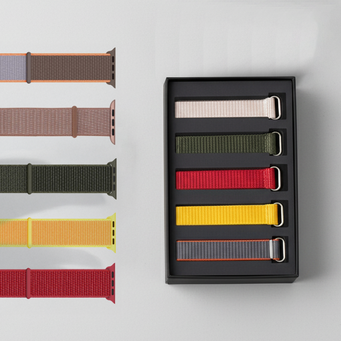A set of health tracker straps, displayed with a black box containing additional bright color straps on a light gray background.